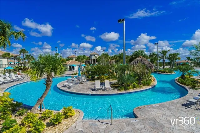 a view of a backyard with plants and a patio