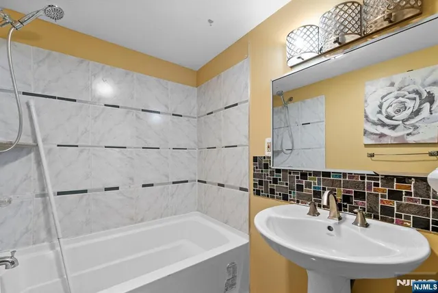 a bedroom with furniture and a fireplace