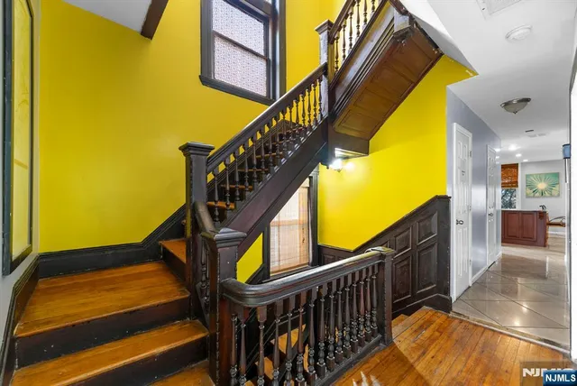 a kitchen with kitchen island granite countertop wooden cabinets a dining table and chairs
