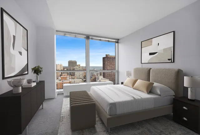 a room with a bed and a flat screen tv