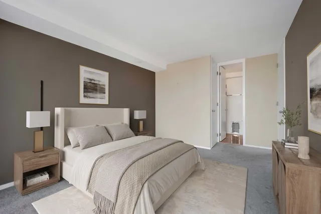 a bedroom with a bed and a couch