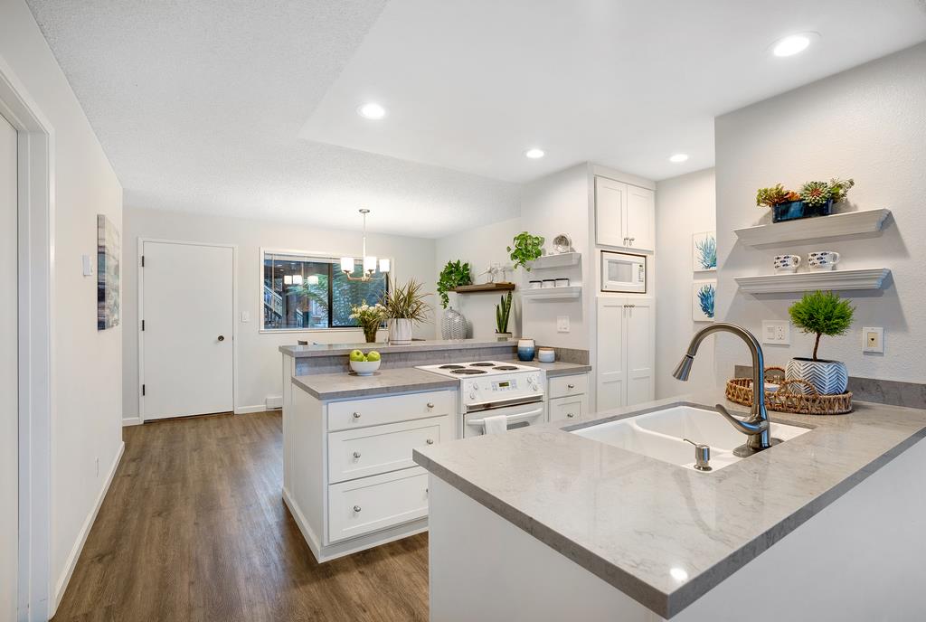 101 Shell Road, Unit 248 Watsonville, CA 95076 - Photo 11 of 28 a kitchen with white cabinets counter space and sink