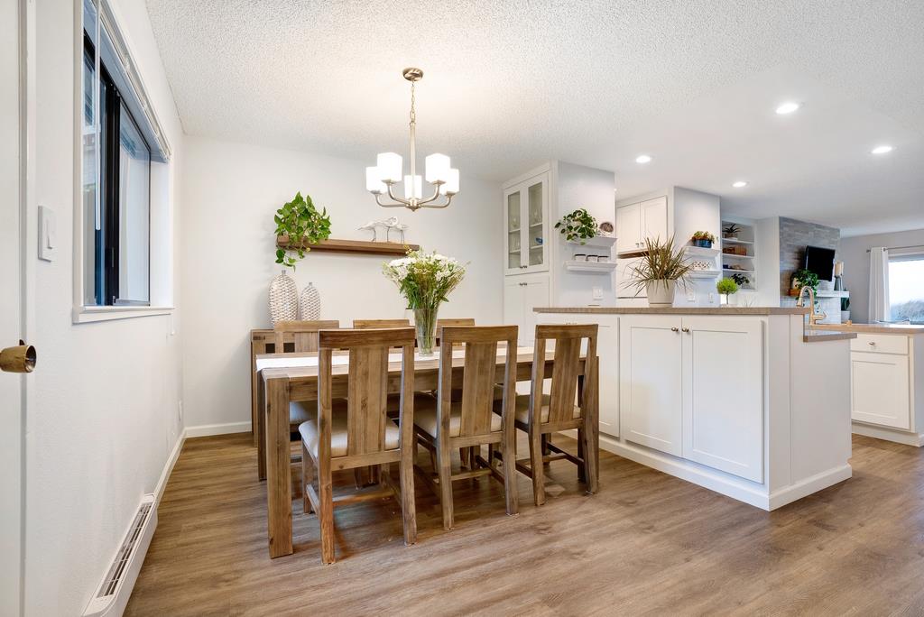 101 Shell Road, Unit 248 Watsonville, CA 95076 - Photo 13 of 28 a view of dining table chairs and wooden floor