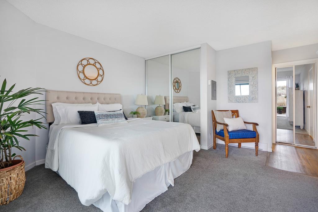 101 Shell Road, Unit 248 Watsonville, CA 95076 - Photo 17 of 28 a bedroom with bed and a potted plant