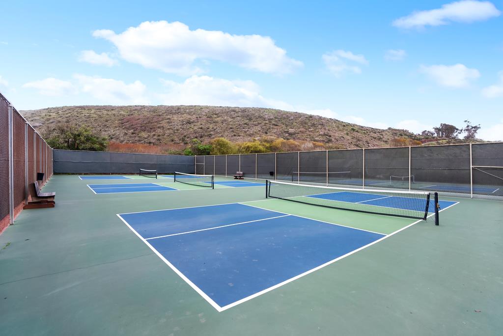 101 Shell Road, Unit 248 Watsonville, CA 95076 - Photo 24 of 28 a view of tennis court with houses