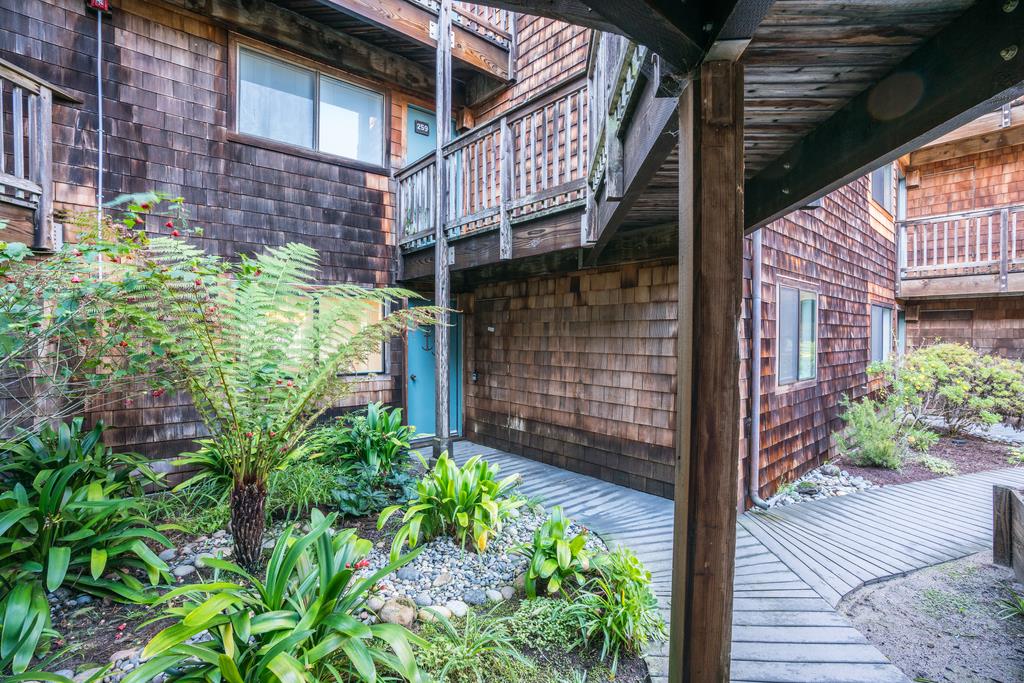 101 Shell Road, Unit 248 Watsonville, CA 95076 - Photo 7 of 28 a view of a brick house with a flower plants and wooden walls