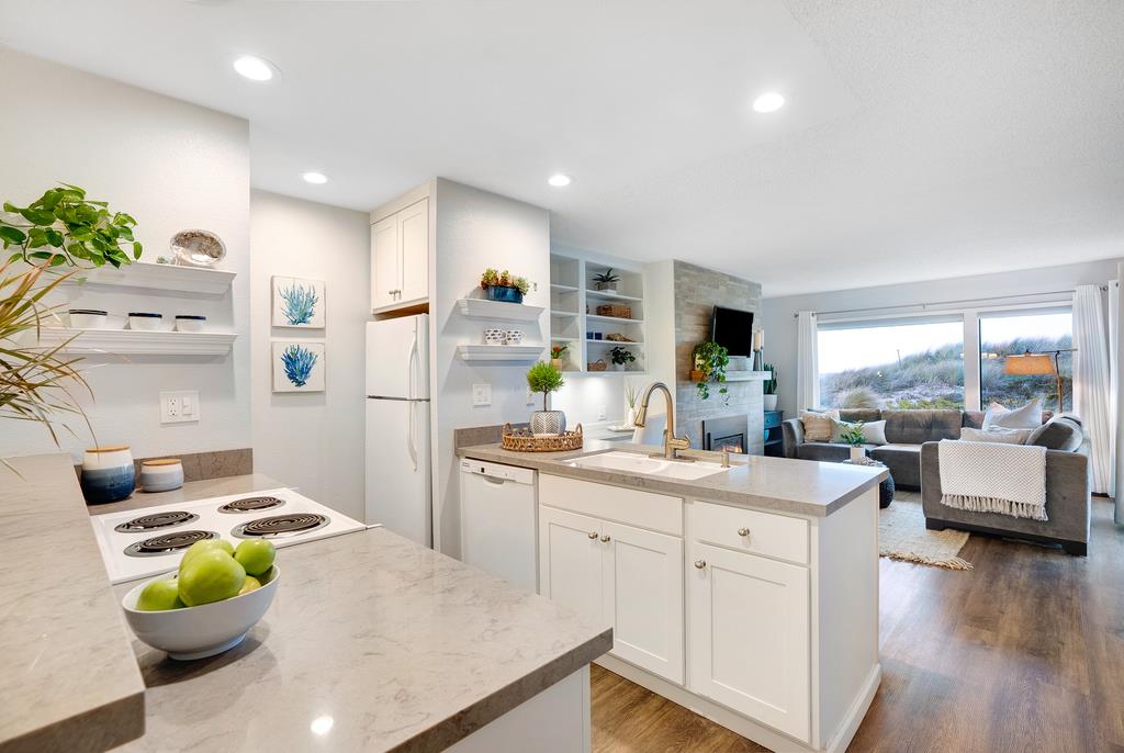 101 Shell Road, Unit 248 Watsonville, CA 95076 - Photo 8 of 28 a kitchen with white cabinets and center island