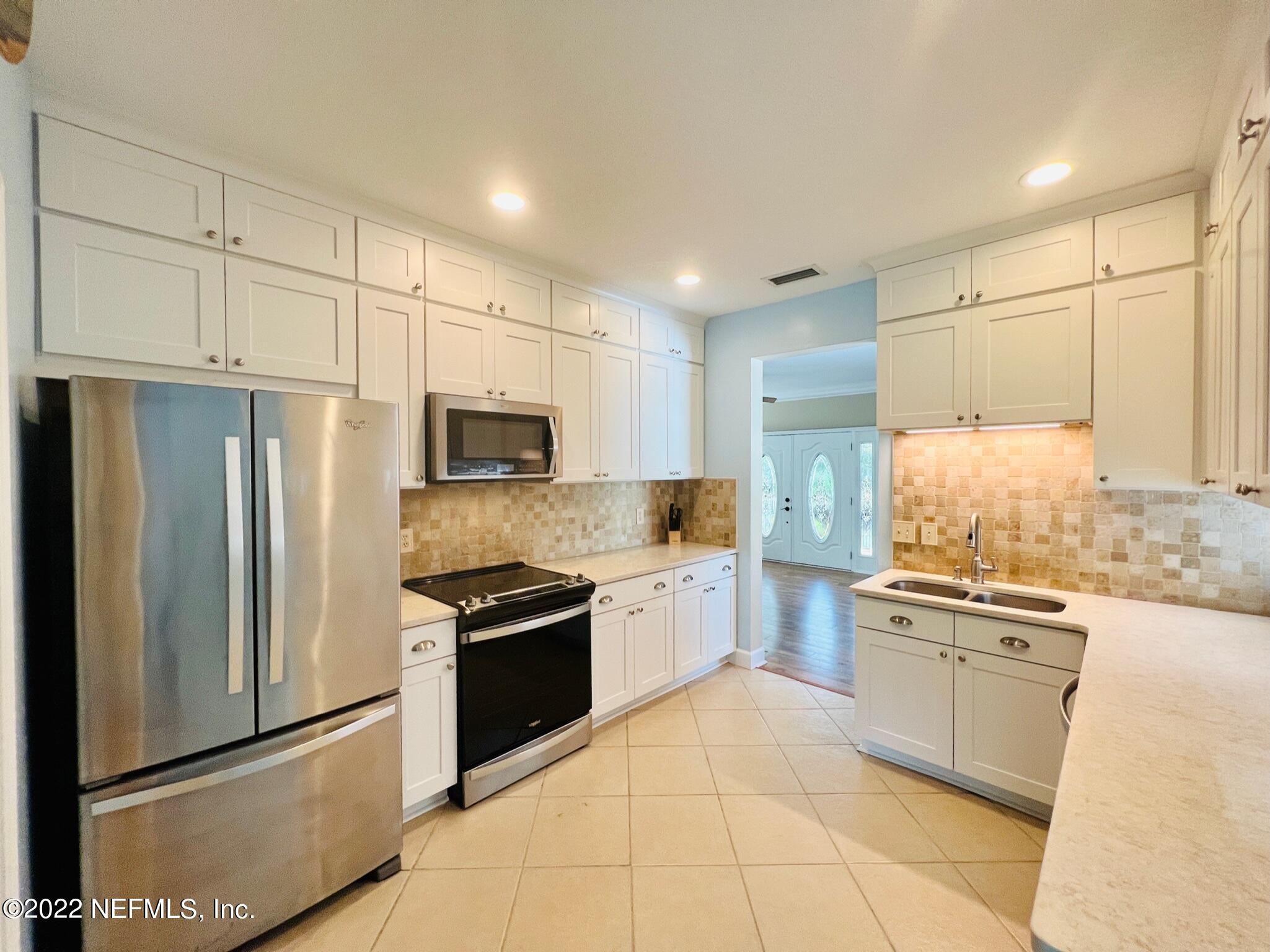 212 Gull Circle Ponte Vedra Beach, FL 32082 - Photo 11 of 49 a kitchen with stainless steel appliances granite countertop a refrigerator sink and stove