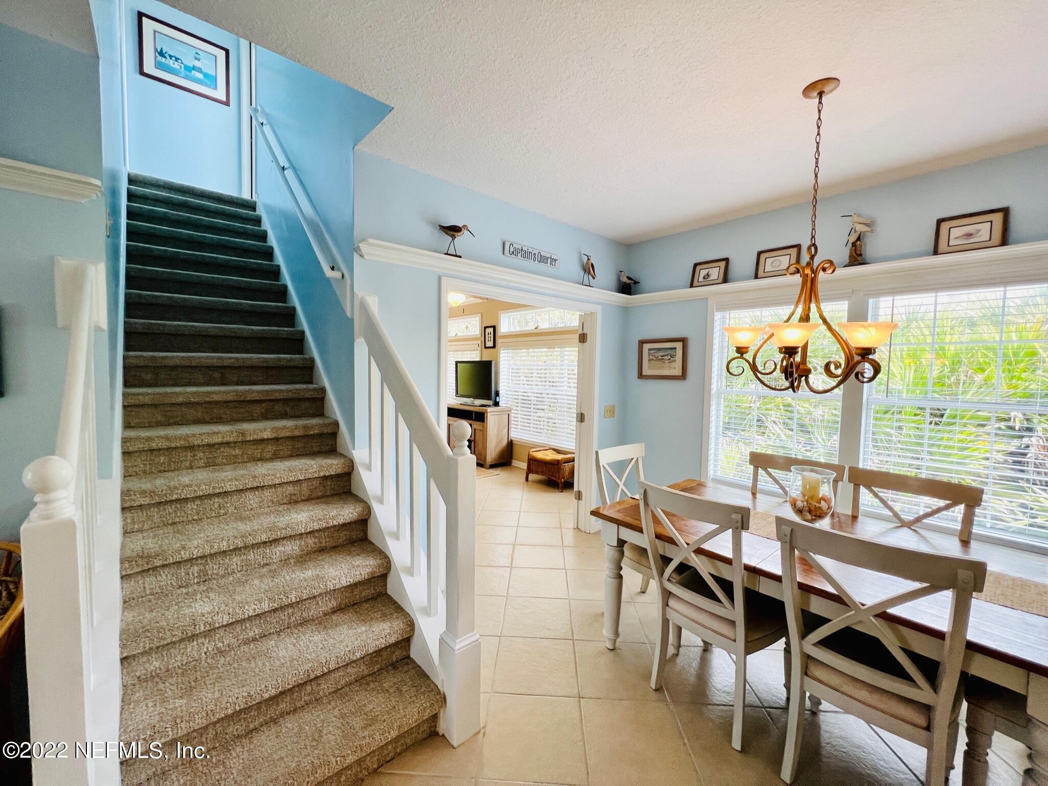 212 Gull Circle Ponte Vedra Beach, FL 32082 - Photo 15 of 49 a dining room with furniture and a floor to ceiling window