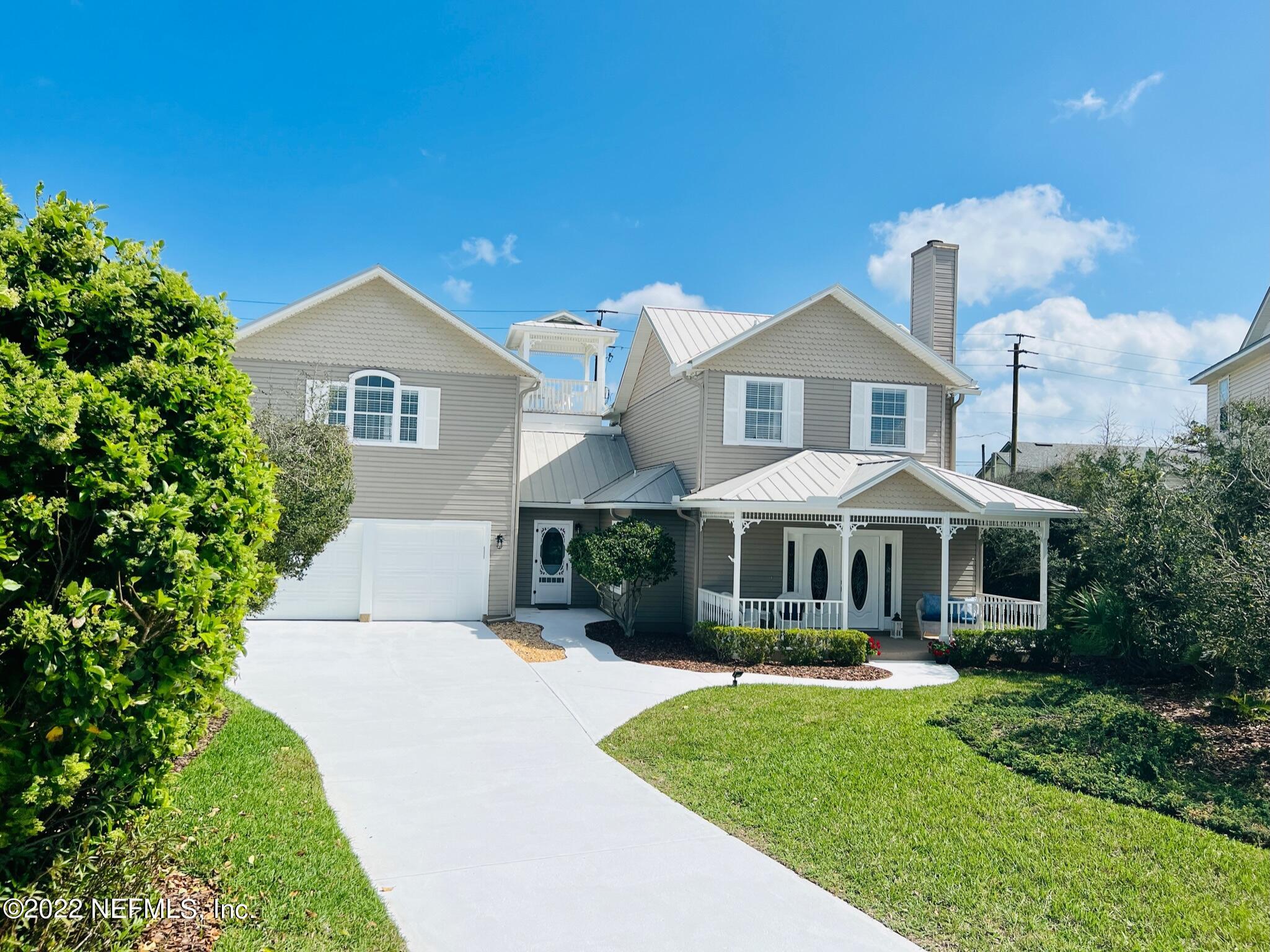212 Gull Circle Ponte Vedra Beach, FL 32082 - Photo 2 of 49 a front view of a house with garden