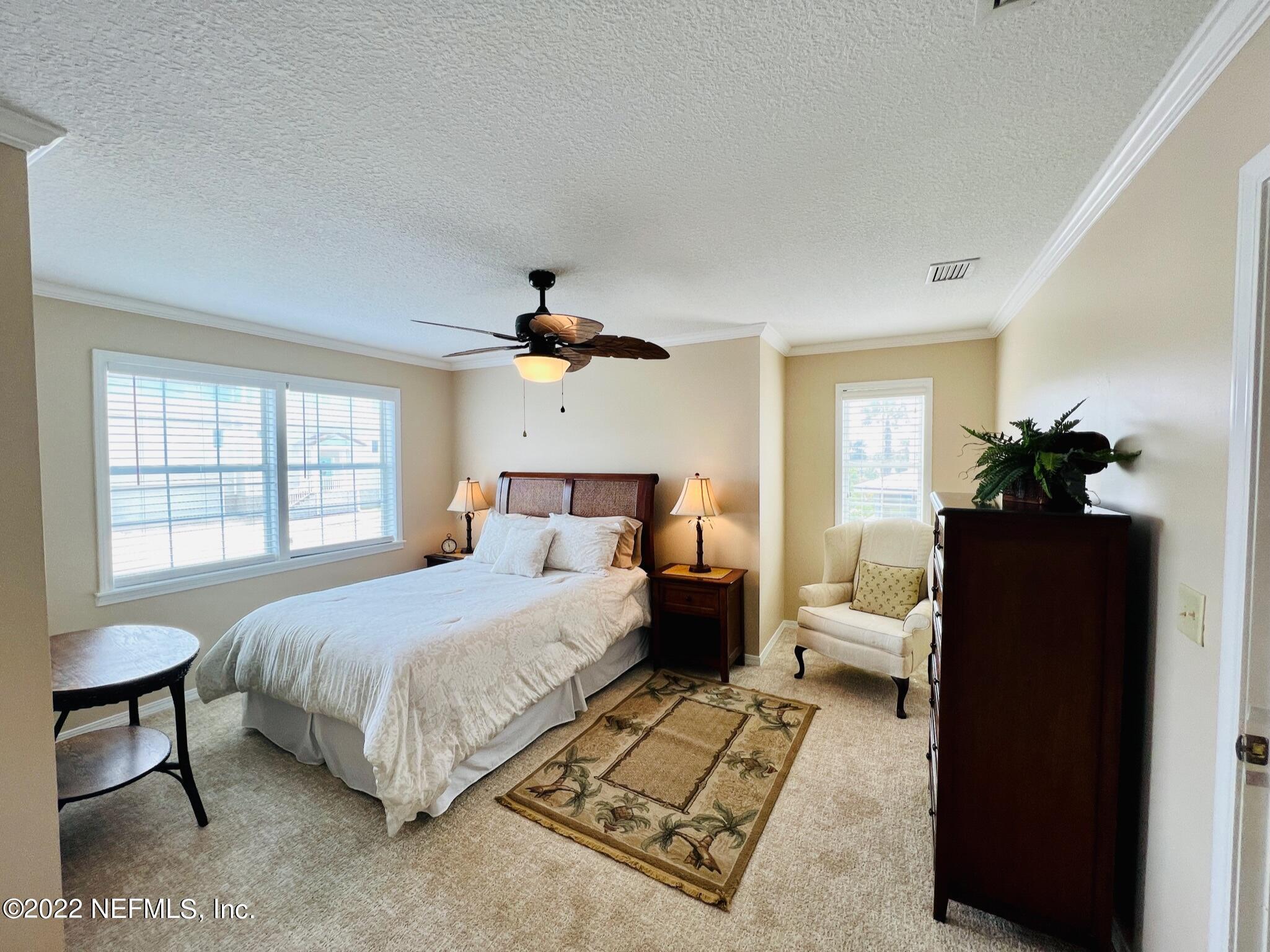 212 Gull Circle Ponte Vedra Beach, FL 32082 - Photo 23 of 49 a bedroom with a bed and a couch