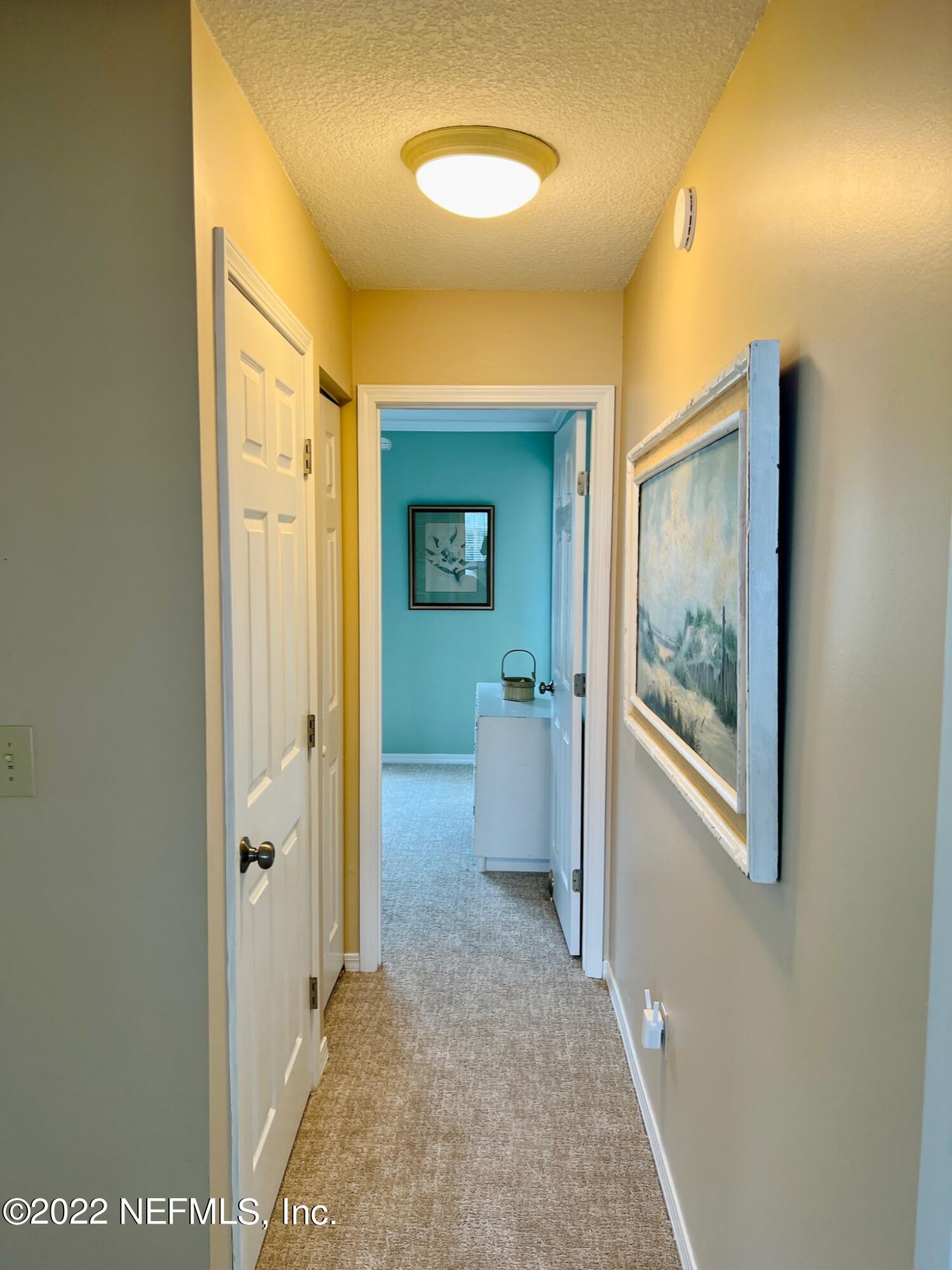 212 Gull Circle Ponte Vedra Beach, FL 32082 - Photo 27 of 49 a view of a hallway with a room