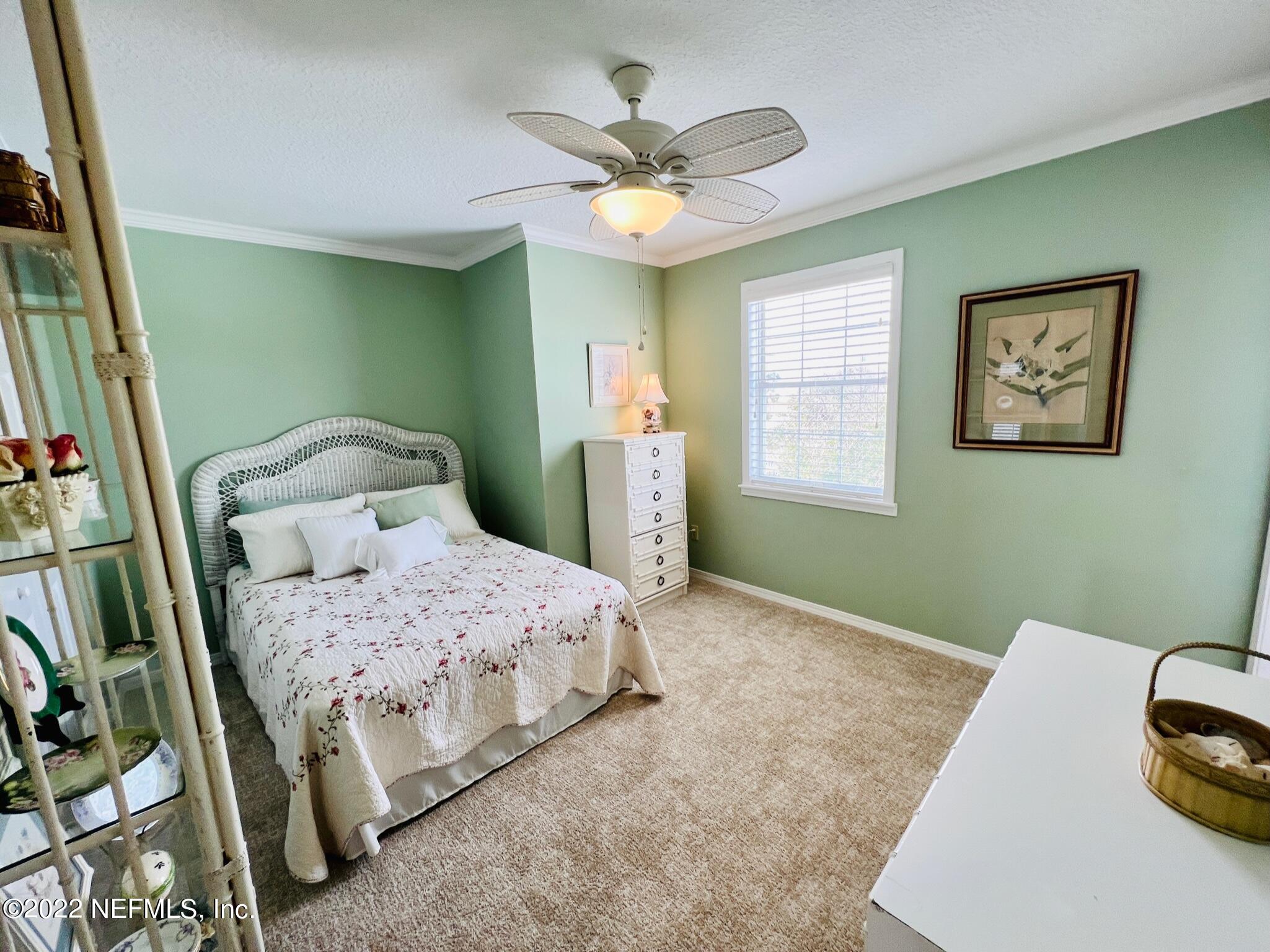 212 Gull Circle Ponte Vedra Beach, FL 32082 - Photo 28 of 49 a bedroom with a bed and a large window