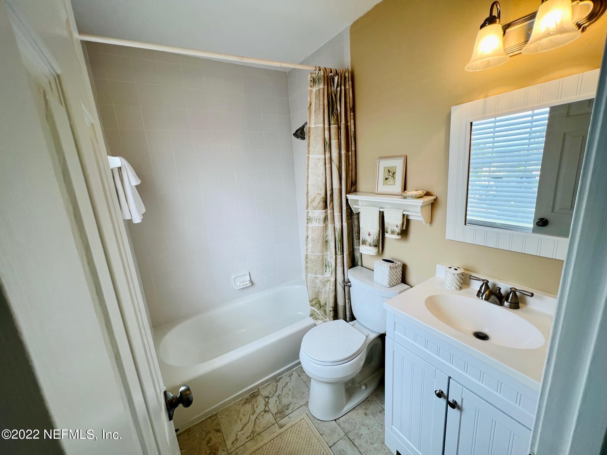 212 Gull Circle Ponte Vedra Beach, FL 32082 - Photo 29 of 49 a bathroom with a bathtub shower sink vanity and toilet