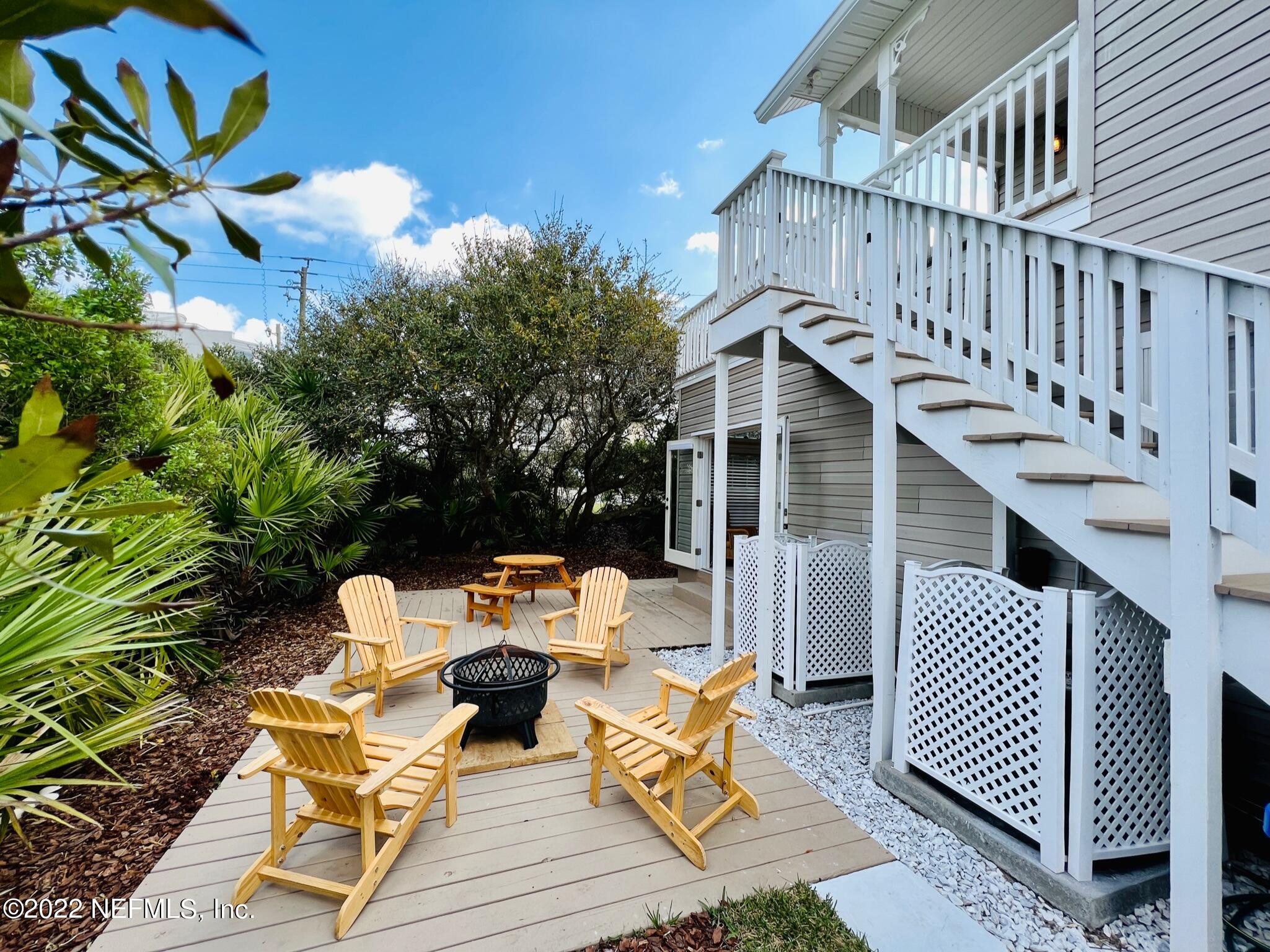 212 Gull Circle Ponte Vedra Beach, FL 32082 - Photo 37 of 49 a view of a house with wooden deck furniture and a potted plant