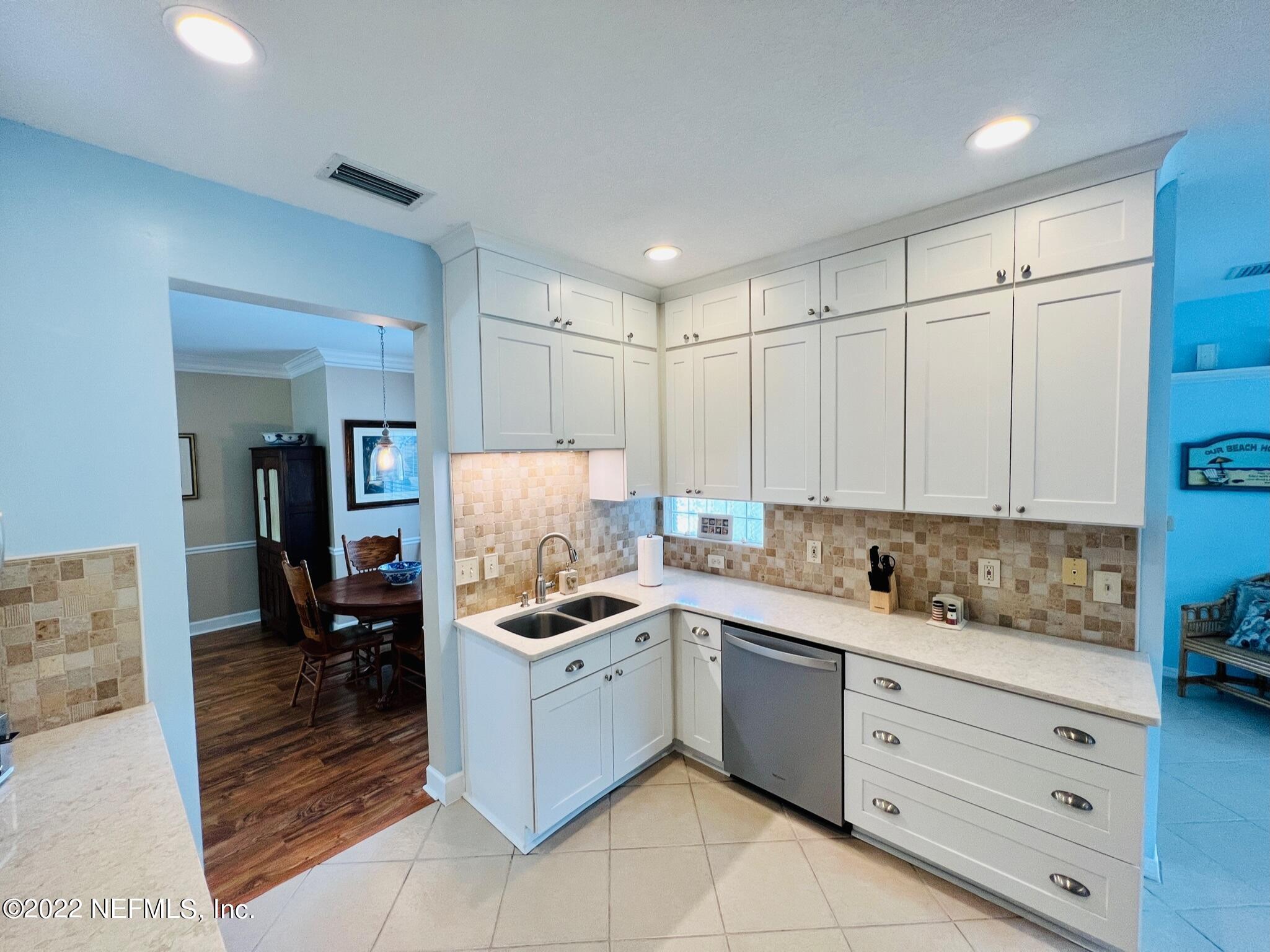 212 Gull Circle Ponte Vedra Beach, FL 32082 - Photo 10 of 49 a kitchen with a sink a stove and cabinets