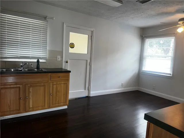 a kitchen with stainless steel appliances a refrigerator stove microwave and sink