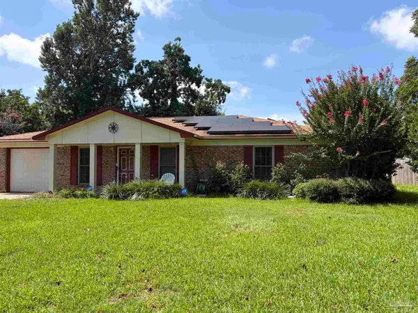 a front view of a house with a garden and porch