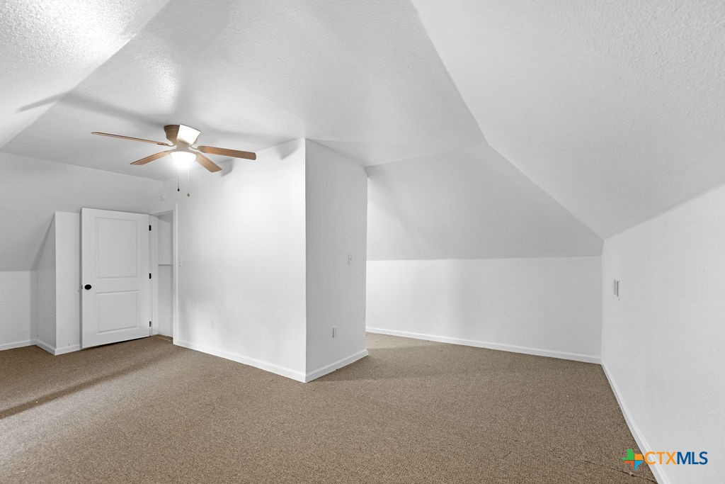 607 West 3rd Street Eddy, TX 76524 - Photo 20 of 29 a view of an empty room with a ceiling fan