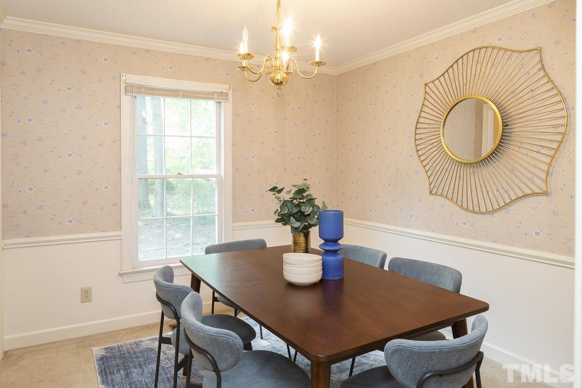 2817 Herring Boulevard Durham, NC 27704 - Photo 14 of 34 a view of a dining room with furniture and wooden floor