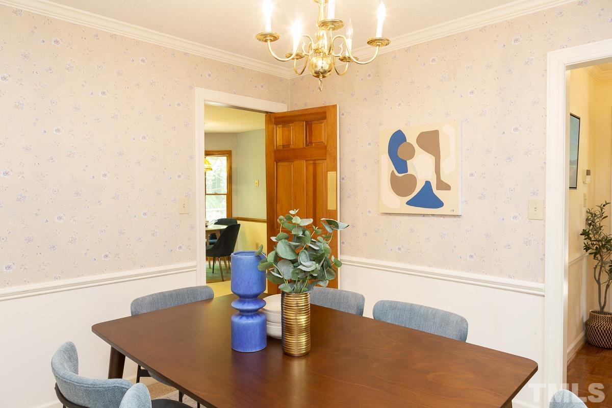 2817 Herring Boulevard Durham, NC 27704 - Photo 15 of 34 a dining room with furniture and wooden floor