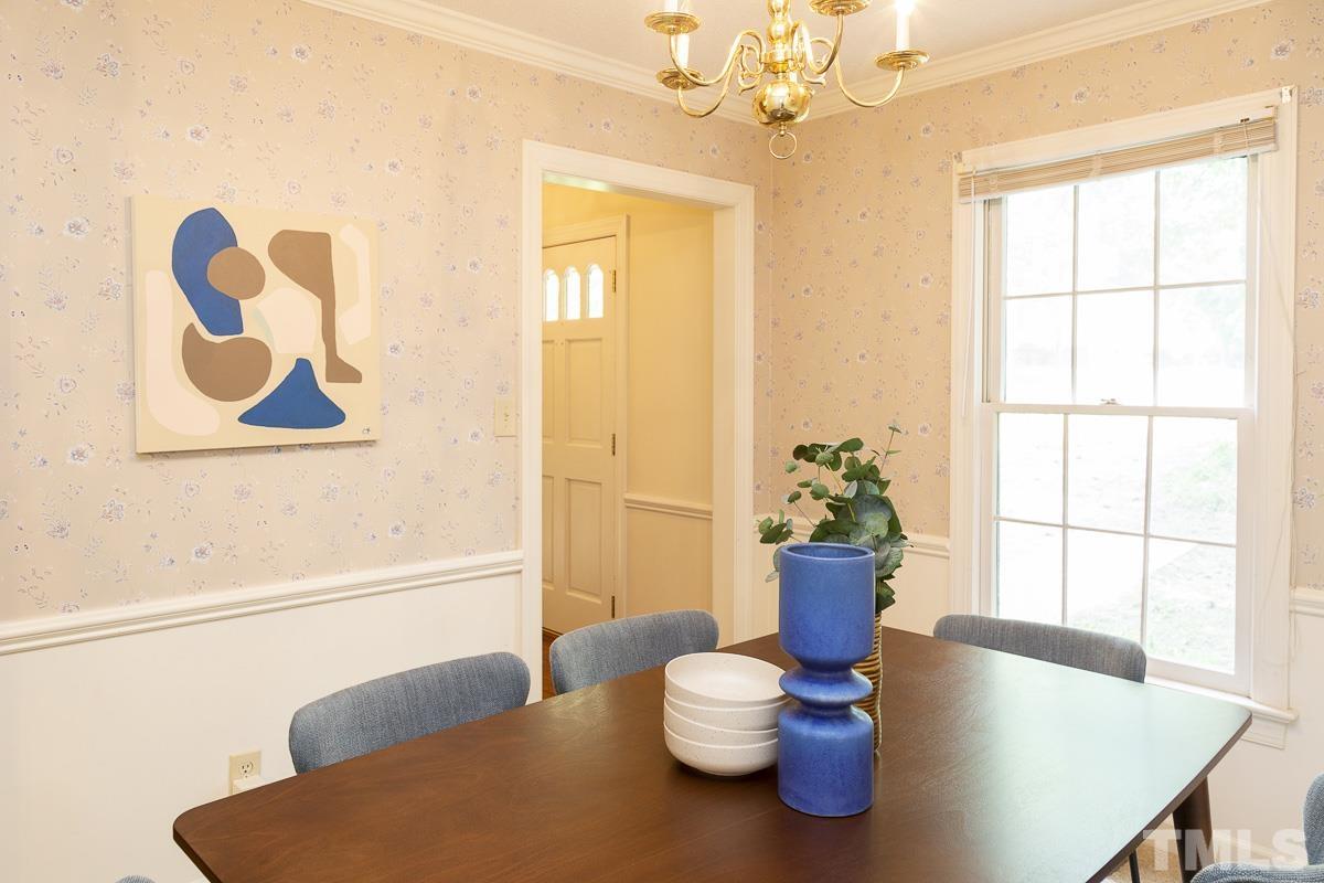2817 Herring Boulevard Durham, NC 27704 - Photo 16 of 34 a view of a dining room with furniture and wooden floor