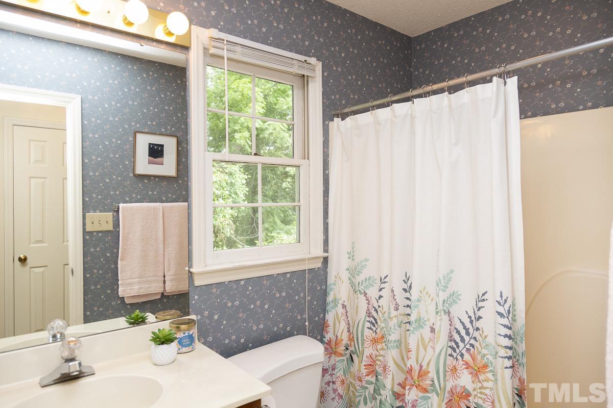 2817 Herring Boulevard Durham, NC 27704 - Photo 26 of 34 a bathroom with a bathtub and sink