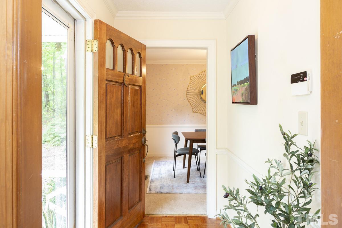 2817 Herring Boulevard Durham, NC 27704 - Photo 4 of 34 a view of a hallway with furniture and a window
