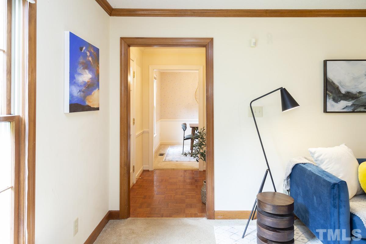 2817 Herring Boulevard Durham, NC 27704 - Photo 9 of 34 a living room with furniture and a painting on the wall