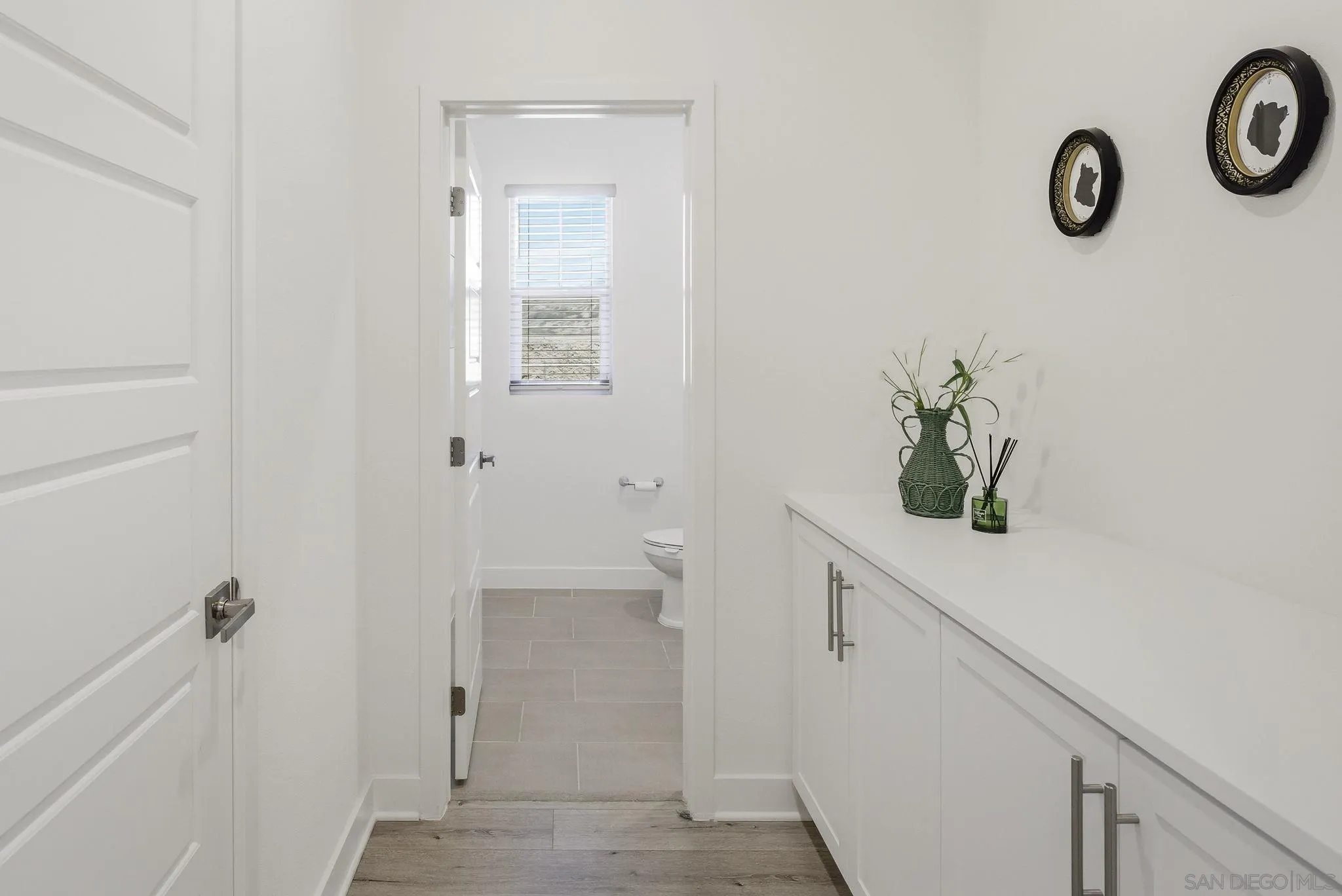 9111 West Bluff Place Santee, CA 92071 - Photo 17 of 36 a bathroom with a sink and a mirror