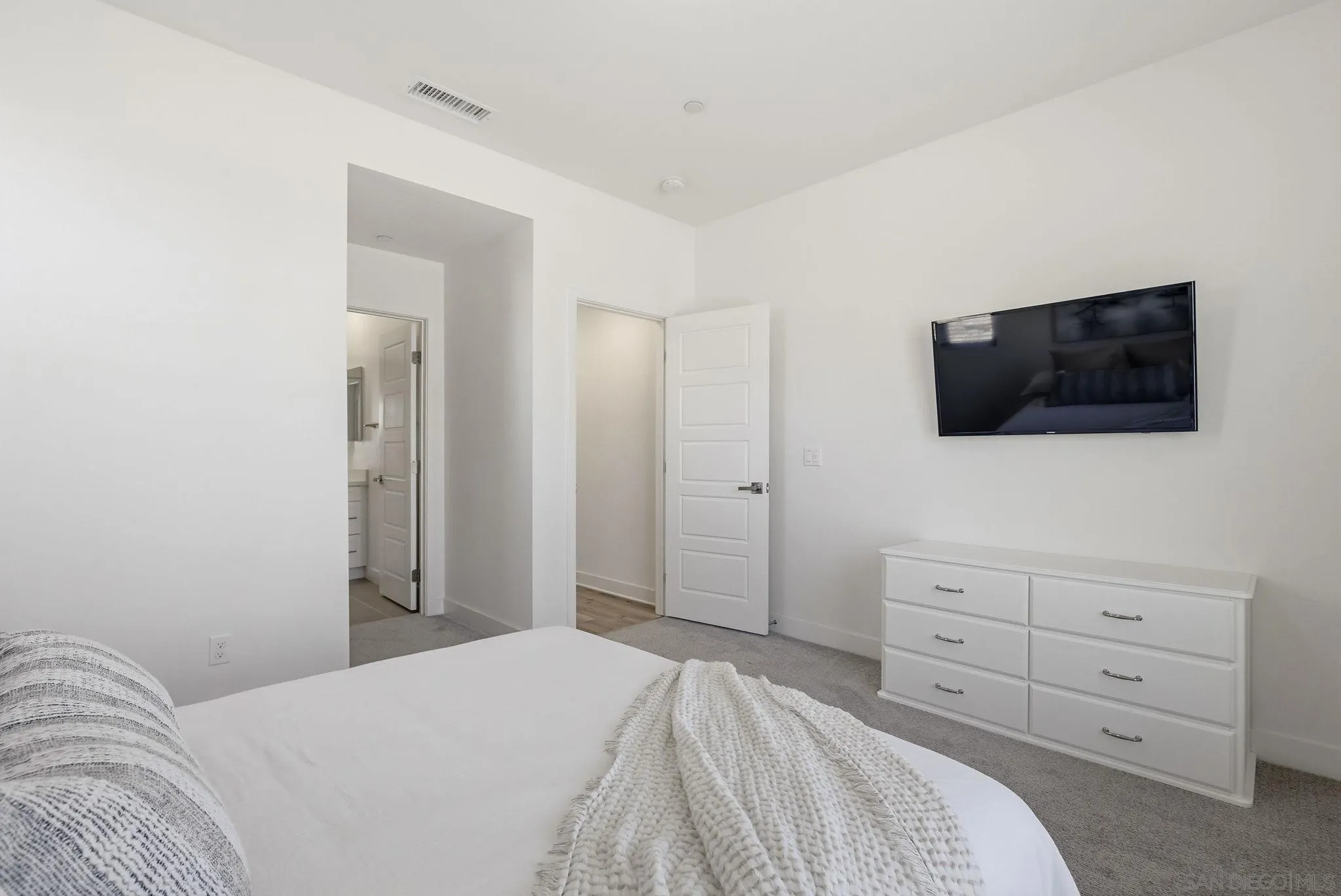 9111 West Bluff Place Santee, CA 92071 - Photo 20 of 36 a bedroom with a bed and a flat screen tv