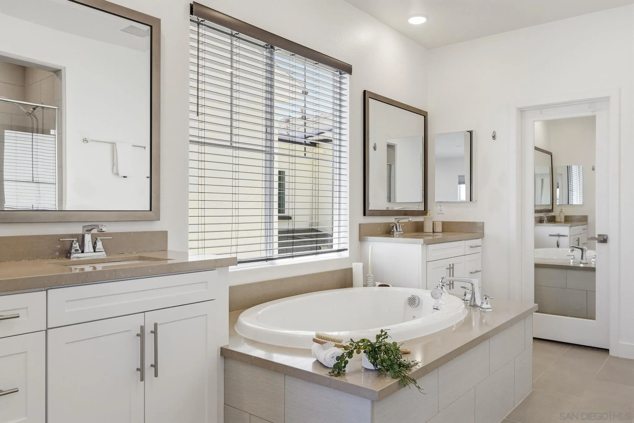 9111 West Bluff Place Santee, CA 92071 - Photo 27 of 36 a bath room with a sink and a mirror