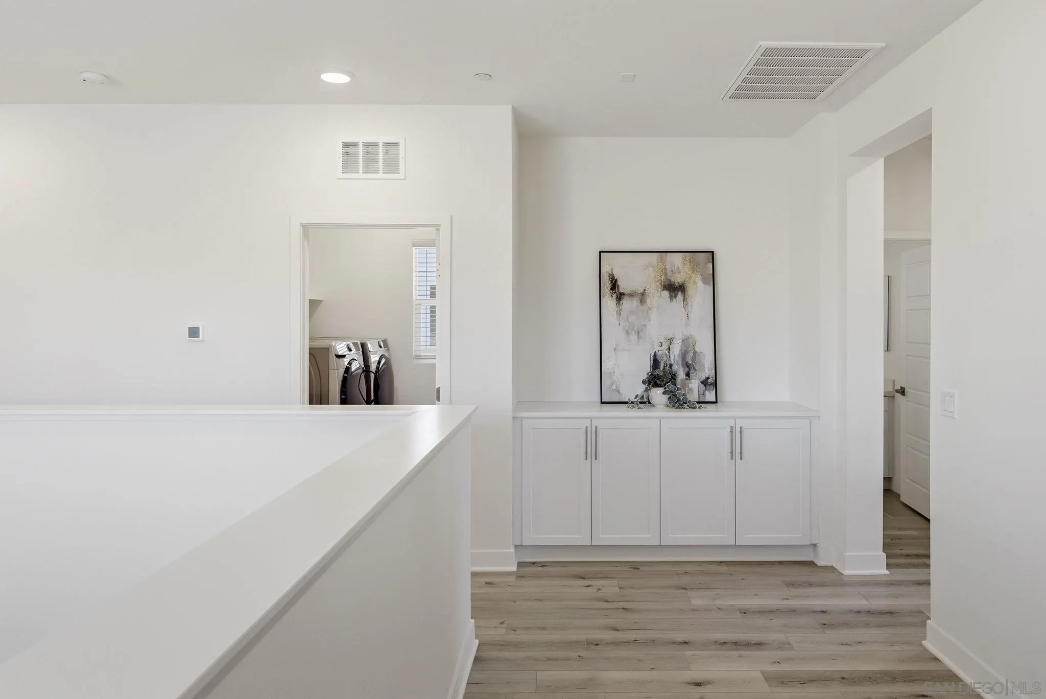 9111 West Bluff Place Santee, CA 92071 - Photo 30 of 36 a view of a hallway with wooden floor