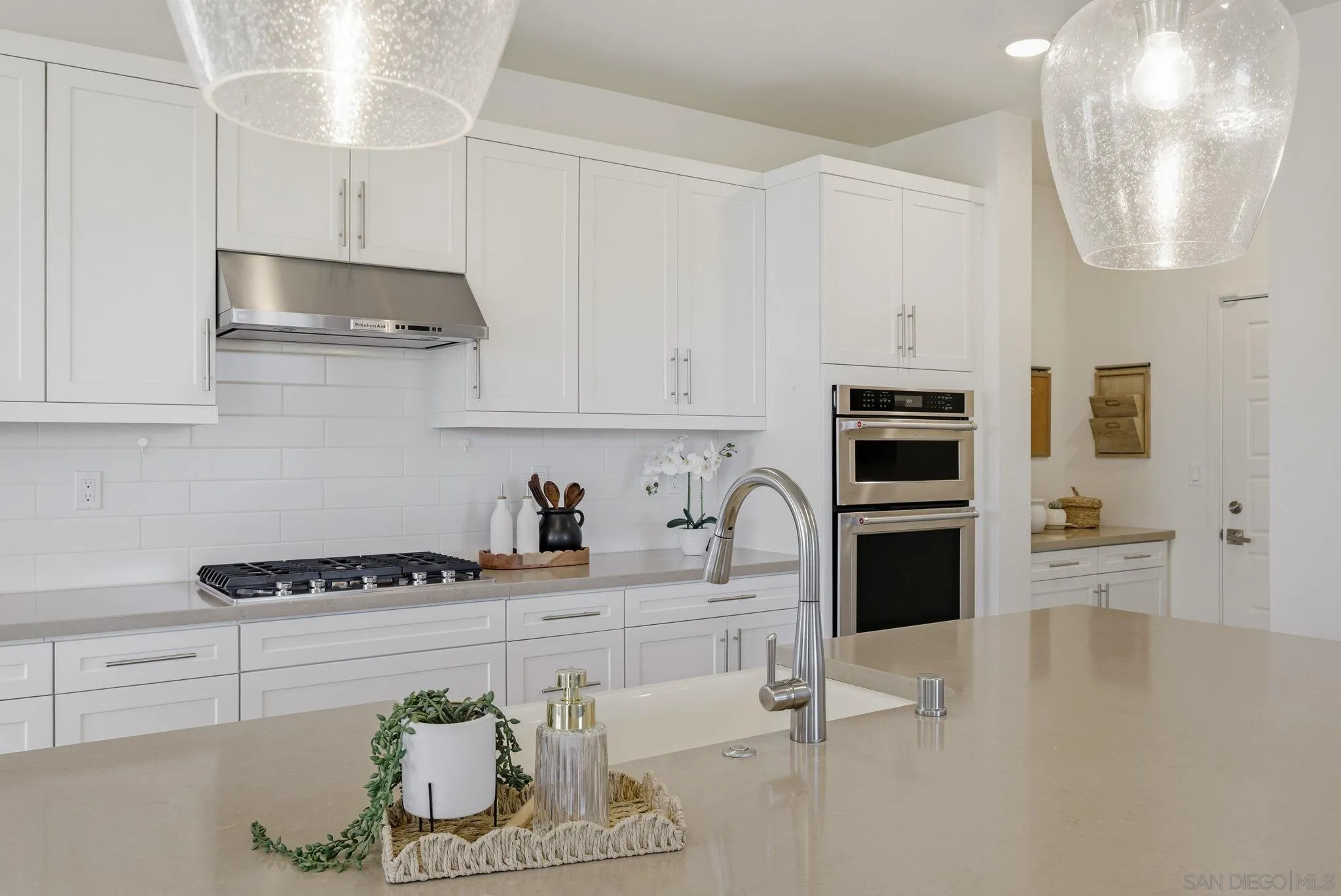 9111 West Bluff Place Santee, CA 92071 - Photo 10 of 36 a kitchen with stainless steel appliances granite countertop a sink and cabinets