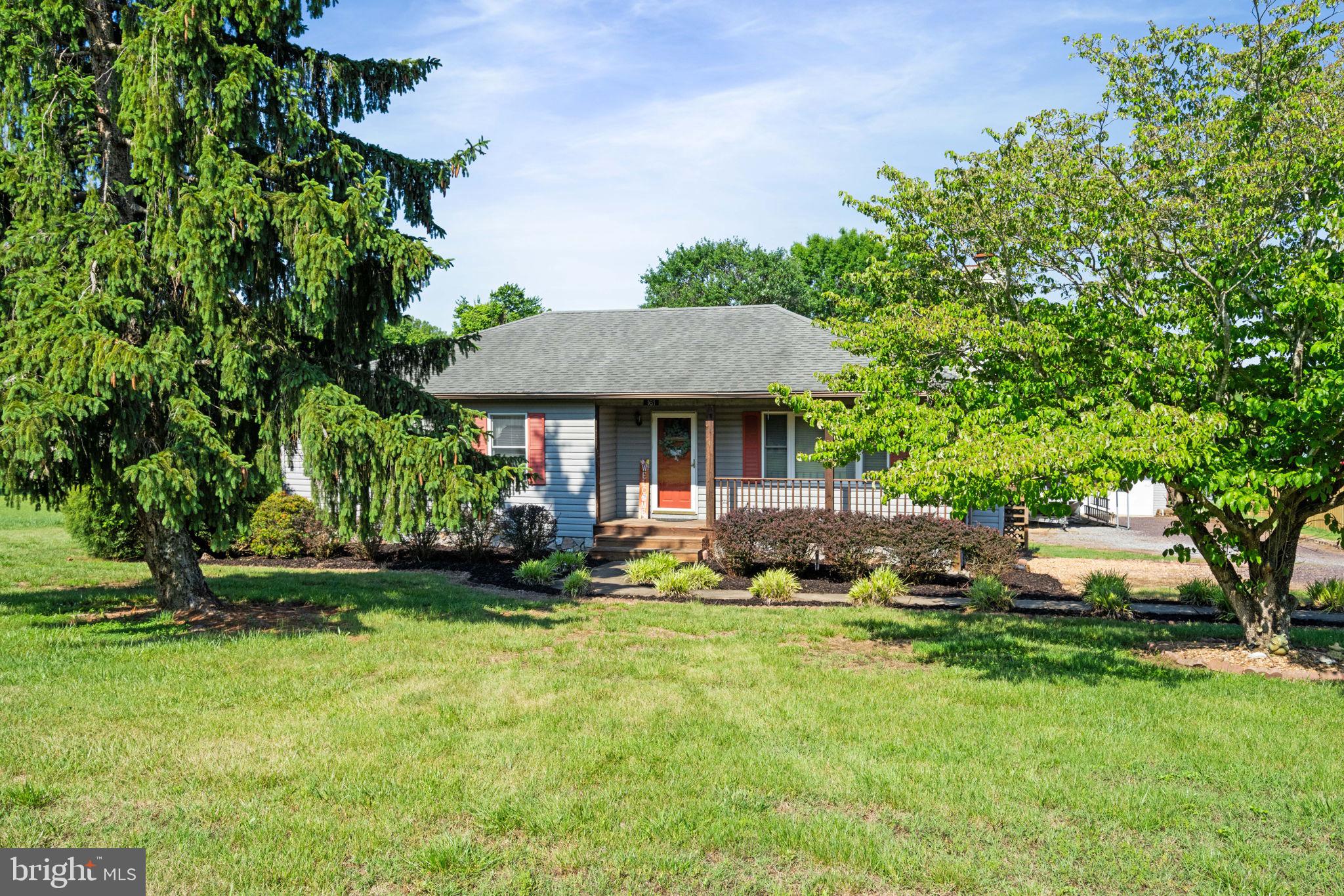 161 Troy Road Louisa, VA 23093 - Photo 11 of 60 a front view of a house with garden and trees
