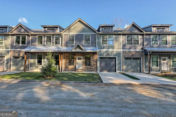 a kitchen with refrigerator cabinets and wooden floor