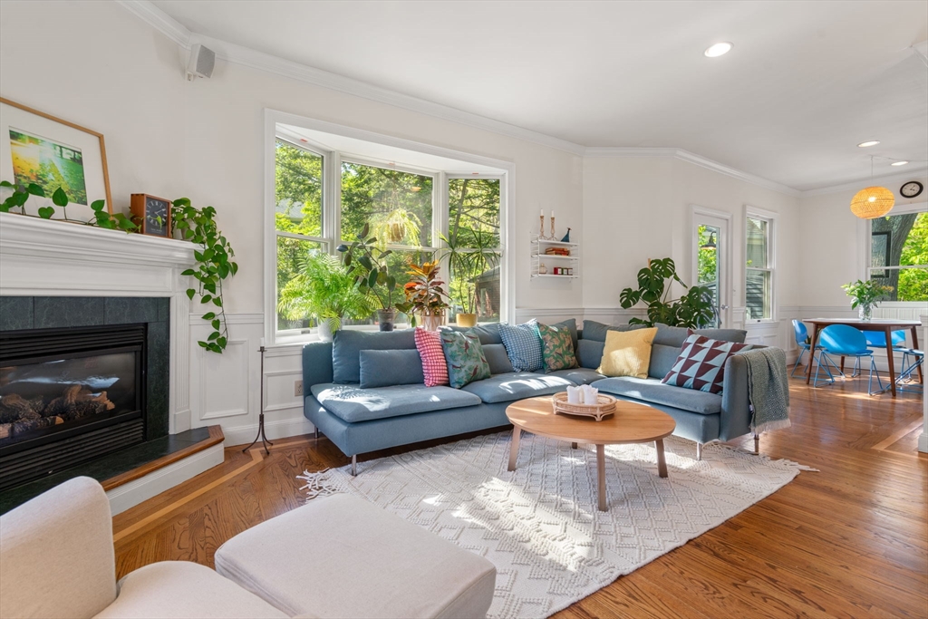 999 Walnut Street Newton, MA 02461 - Photo 11 of 38 a living room with furniture and a fireplace
