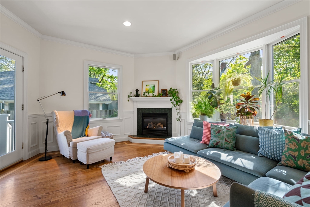 999 Walnut Street Newton, MA 02461 - Photo 12 of 38 a living room with furniture and a fireplace