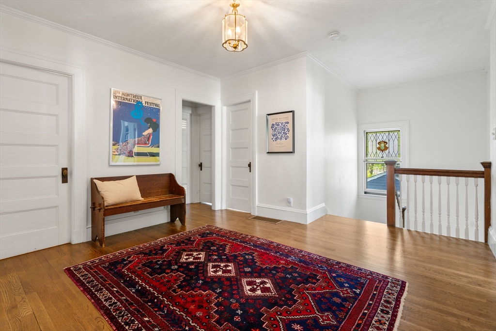 999 Walnut Street Newton, MA 02461 - Photo 18 of 38 a living room with a couch and a rug