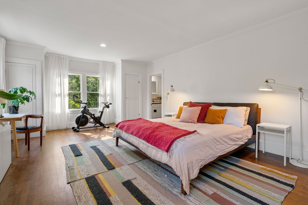 999 Walnut Street Newton, MA 02461 - Photo 22 of 38 a bedroom with a bed and wooden floor