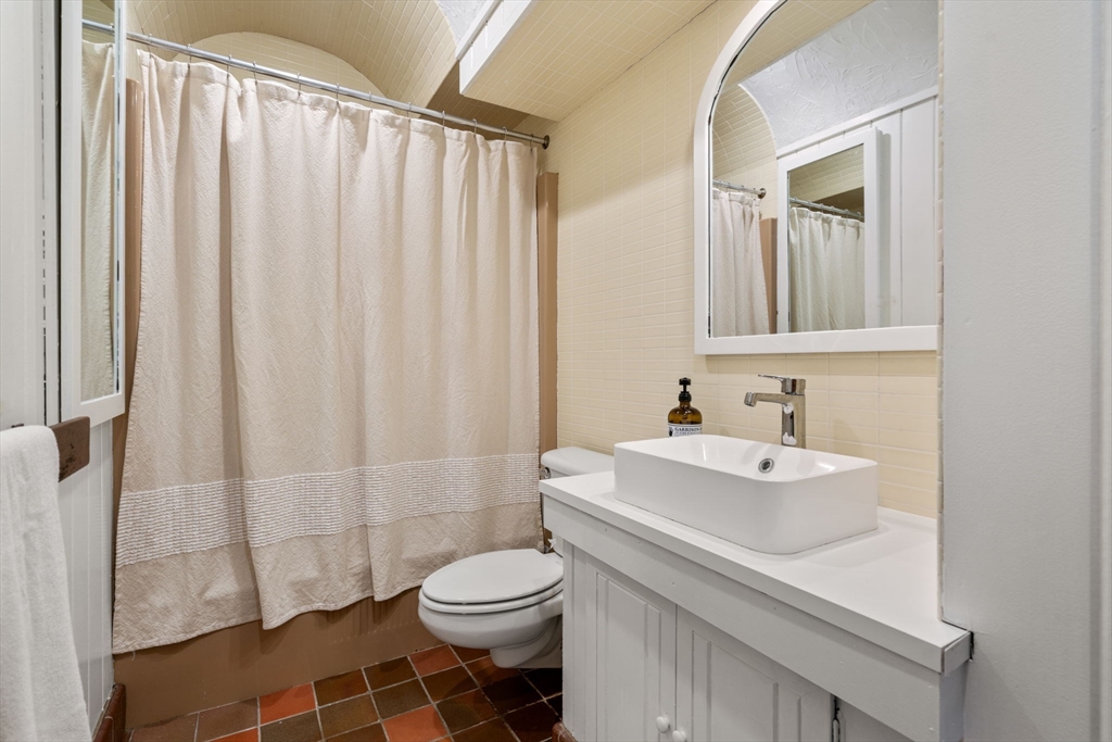 999 Walnut Street Newton, MA 02461 - Photo 25 of 38 a bathroom with a sink a toilet and shower