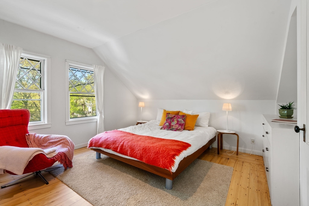 999 Walnut Street Newton, MA 02461 - Photo 28 of 38 a bedroom with a bed and a couch