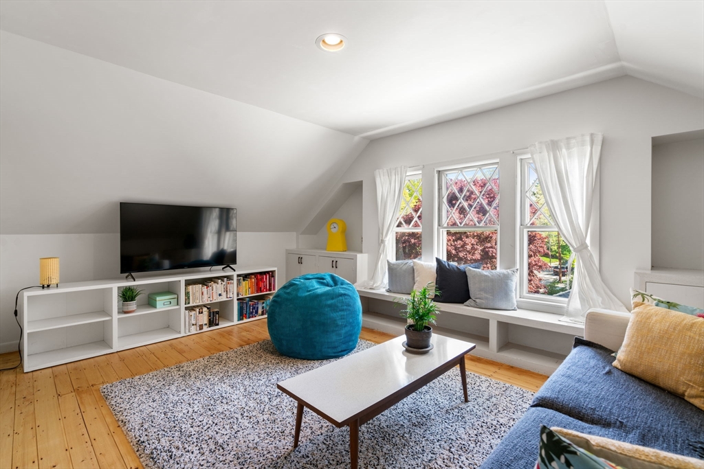 999 Walnut Street Newton, MA 02461 - Photo 31 of 38 a living room with furniture and a flat screen tv