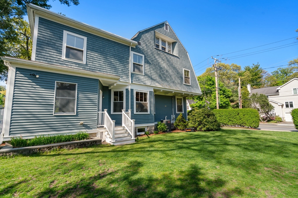 999 Walnut Street Newton, MA 02461 - Photo 32 of 38 a front view of a house with a yard