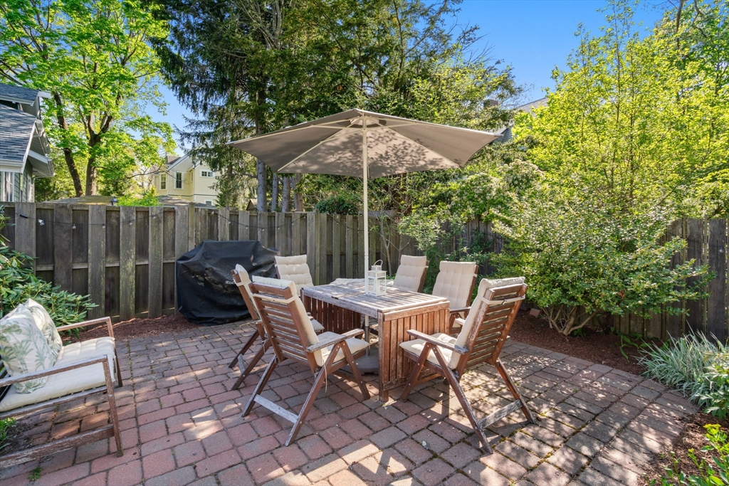 999 Walnut Street Newton, MA 02461 - Photo 34 of 38 a view of backyard with a patio and outdoor seating
