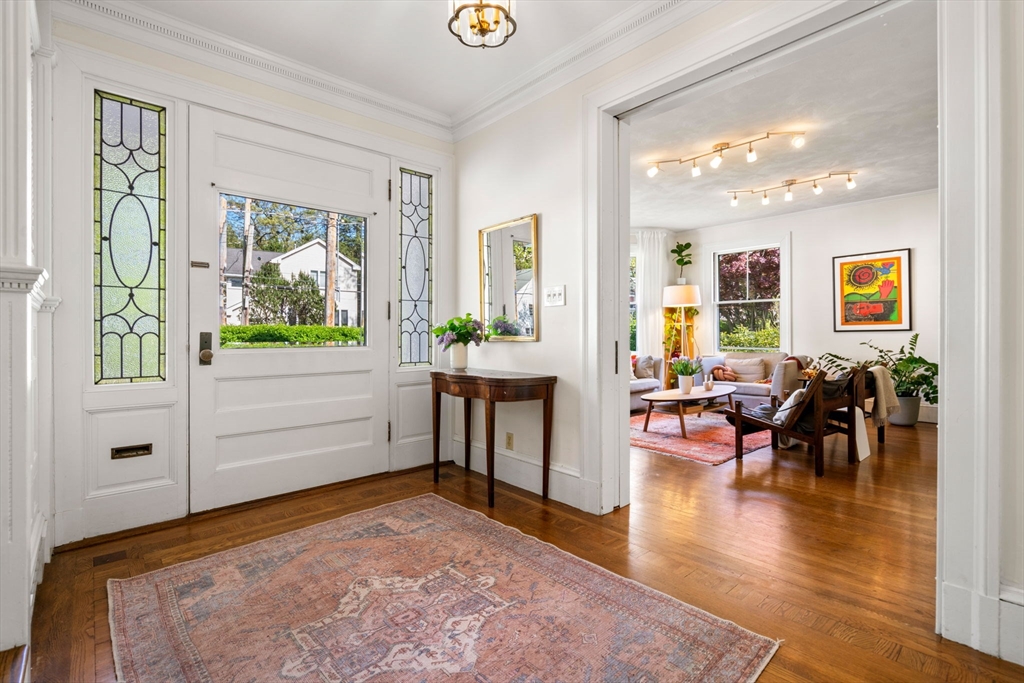 999 Walnut Street Newton, MA 02461 - Photo 7 of 38 a bedroom with furniture and a wooden floor