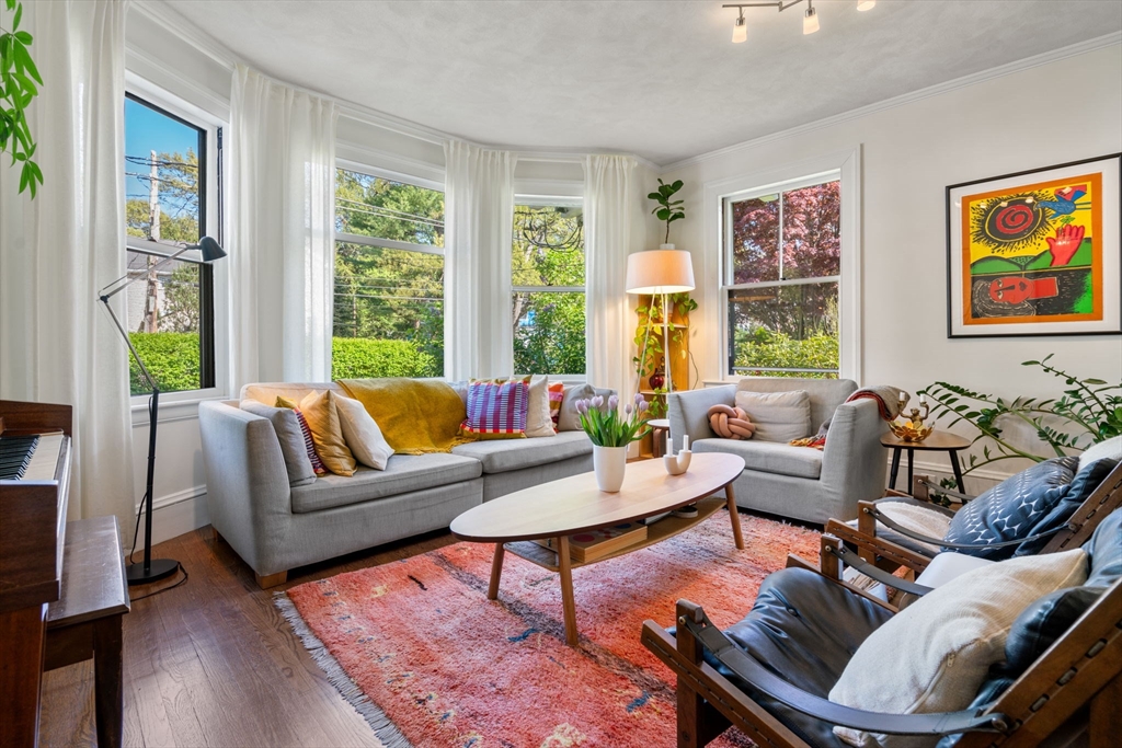 999 Walnut Street Newton, MA 02461 - Photo 8 of 38 a living room with furniture large window and wooden floor