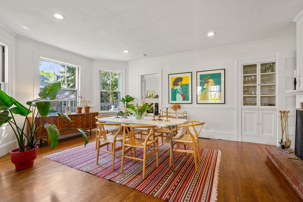 999 Walnut Street Newton, MA 02461 - Photo 9 of 38 a view of a dining room with furniture a rug and wooden floor
