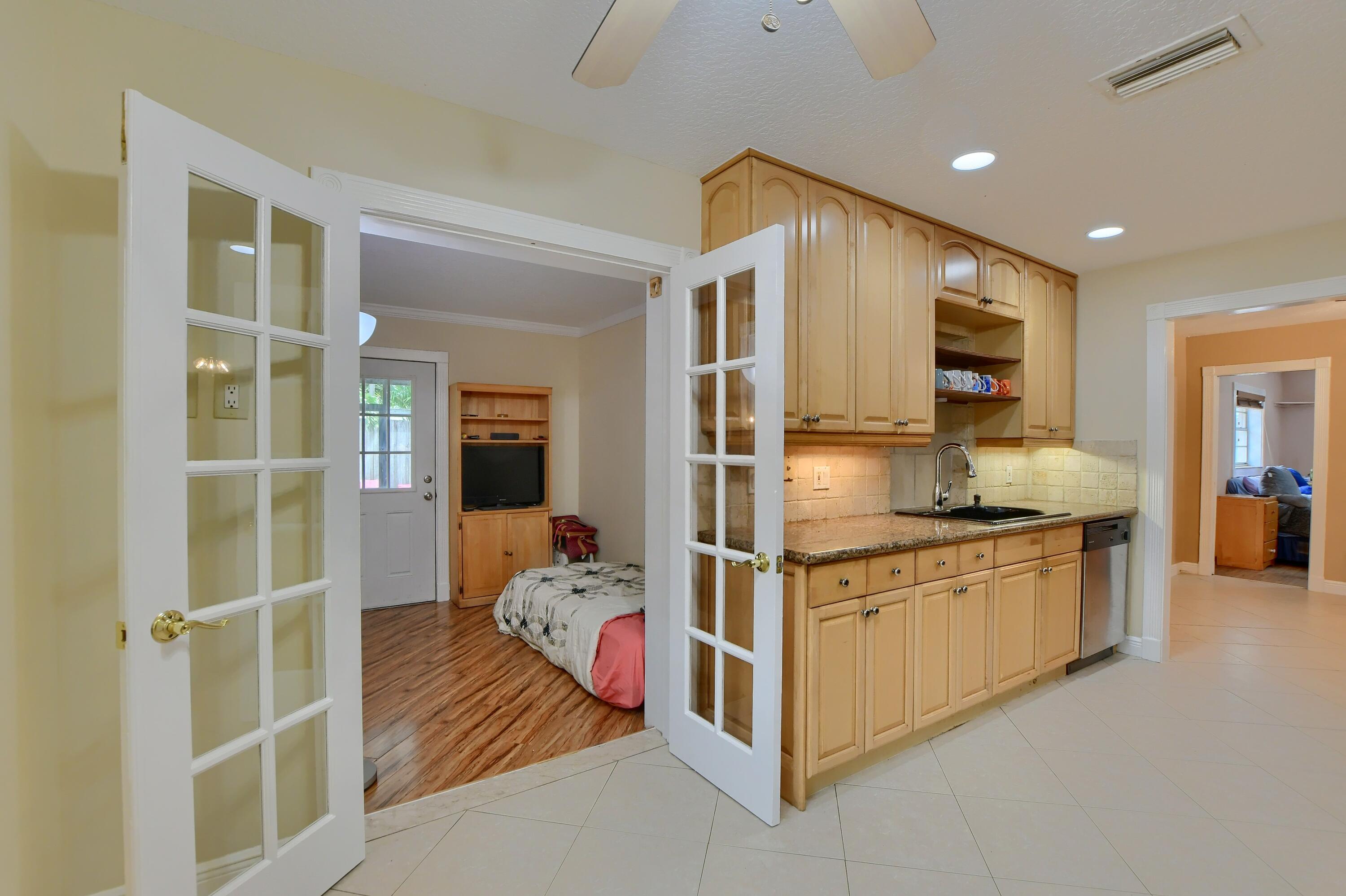 22668 Southwest 54th Way Boca Raton, FL 33433 - Photo 25 of 32 Kitchen leading to the Den