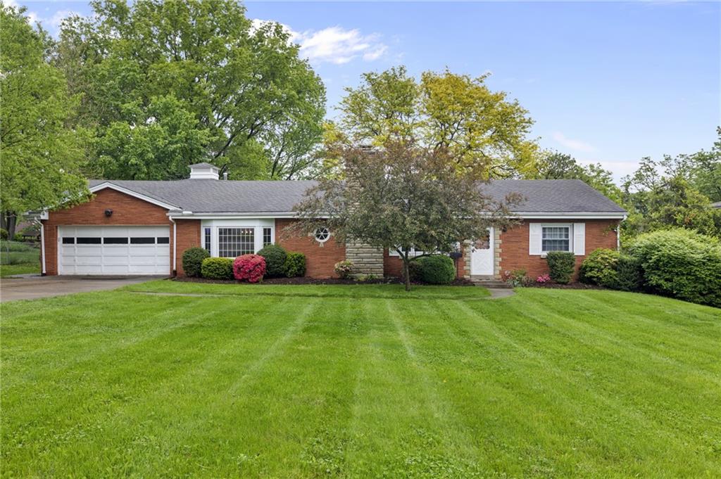 a front view of a house with a garden and porch